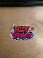 "Not today" graffiti-style vinyl sticker on desk