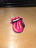 Pink lips and tongue vinyl sticker on desk
