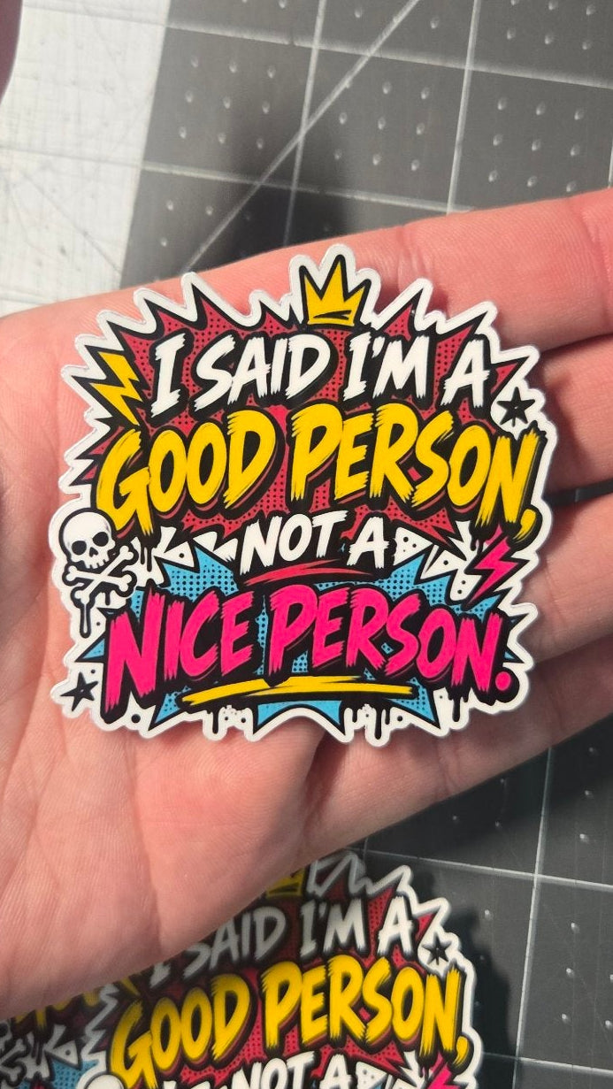 Hand holding "I said I'm a good person, not a nice person" vinyl sticker